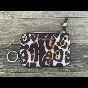 Victoria’s Secret leopard cosmetic/coin case.